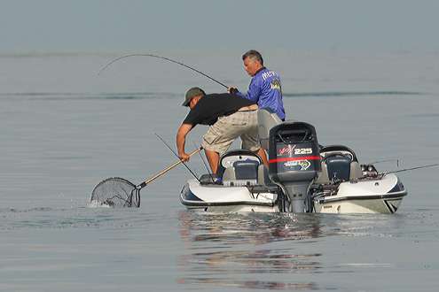 <p>
Brian Metry catches one and his co-angler helps net the fish.</p>