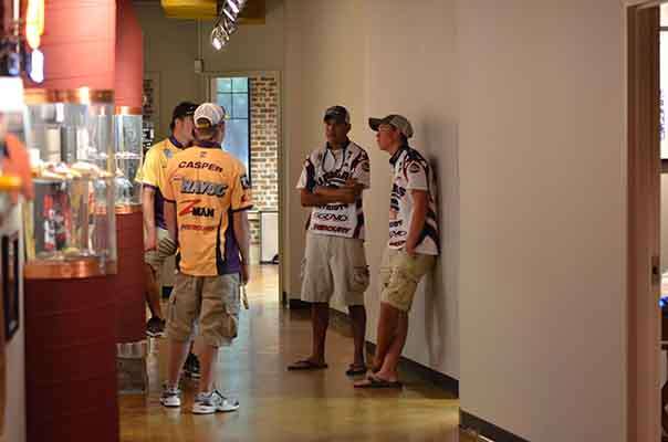 <p>
Anglers discuss strategy in the hallway at the JM offices where registration is being held.</p>