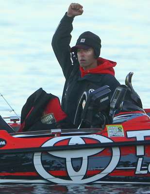 He celebrates with a fist pump.