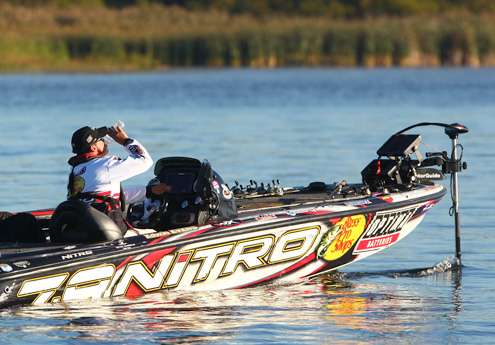 Edwin Evers grabs a quick drink of water while making a short move.