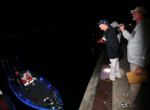 Tournament officials conduct the morning safety inspection and live well check of every boat.
