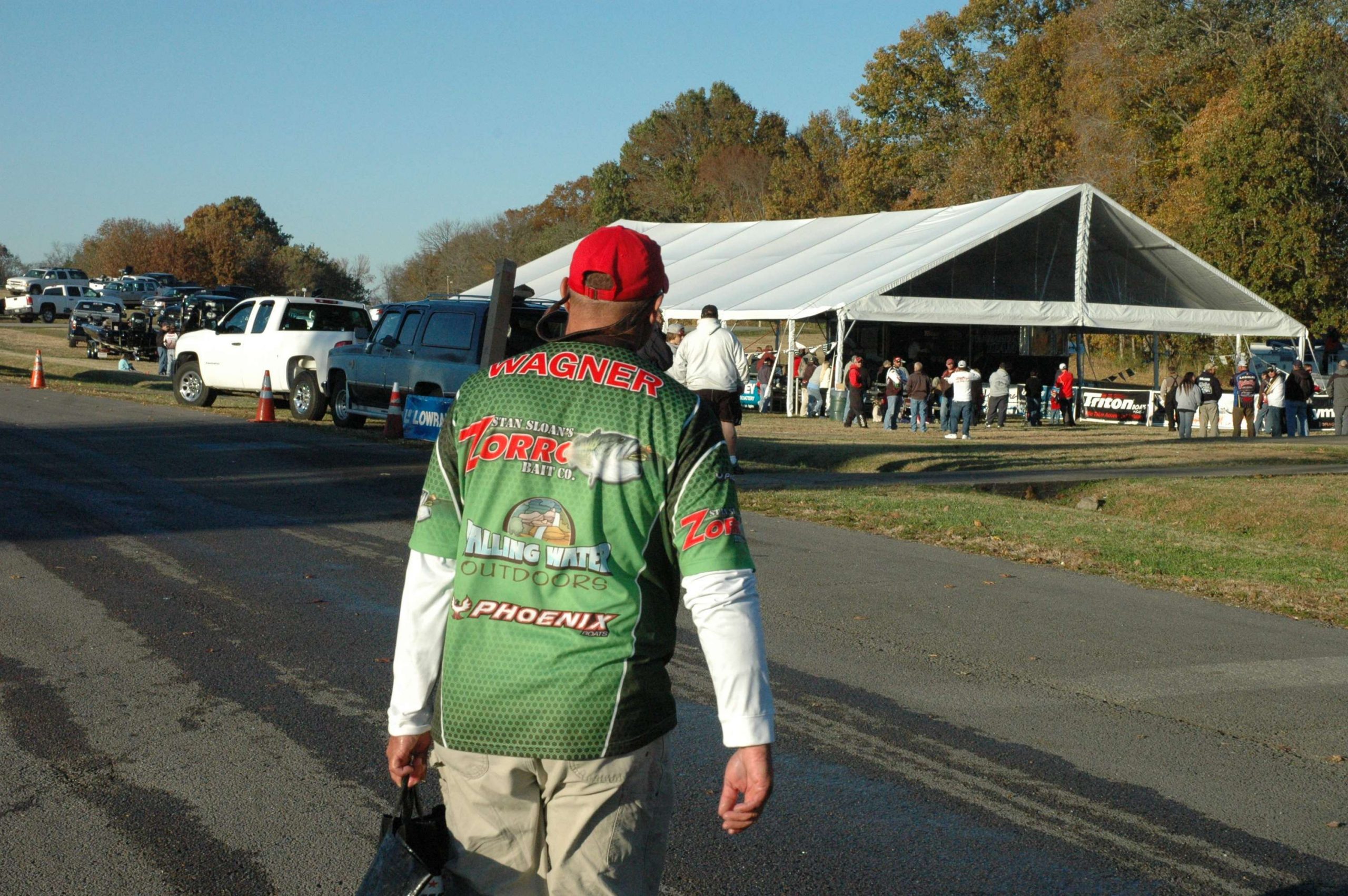 Adam Wagner begins the long walk back to the weigh-in tent. This time he goes with a bag filled with fish. The hot seat awaits again.