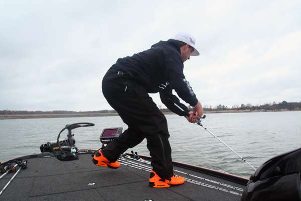 1:41 p.m. Shryock carefully plays a bass that hit his jerkbait near a deep retaining wall.