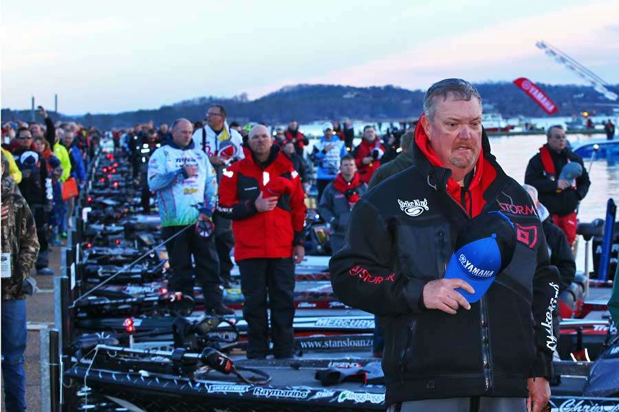 Mark Davis stands at attention for the national anthem.