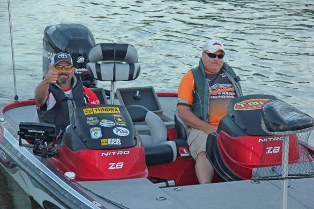 Robert Levis and Shane Barker offer an optimistic âthumbs upâ as they idle out.