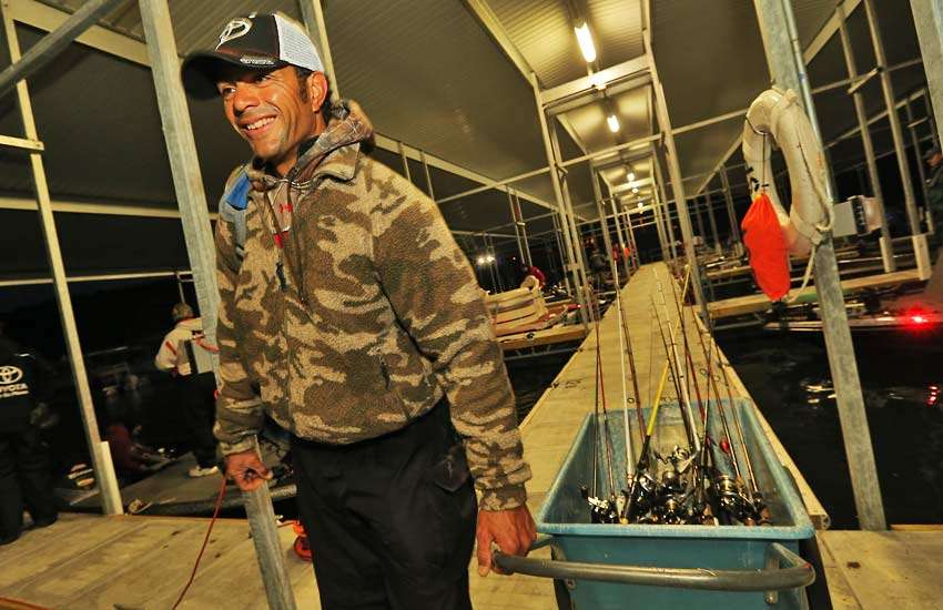 Sidney Reeves of Utah carts his rods down to the boat.