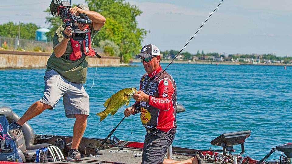 On the water with an angler in competition he was in constant motion trying every angle to get a shot of the action for those watching on Bassmaster LIVE or the Bassmaster Television show.