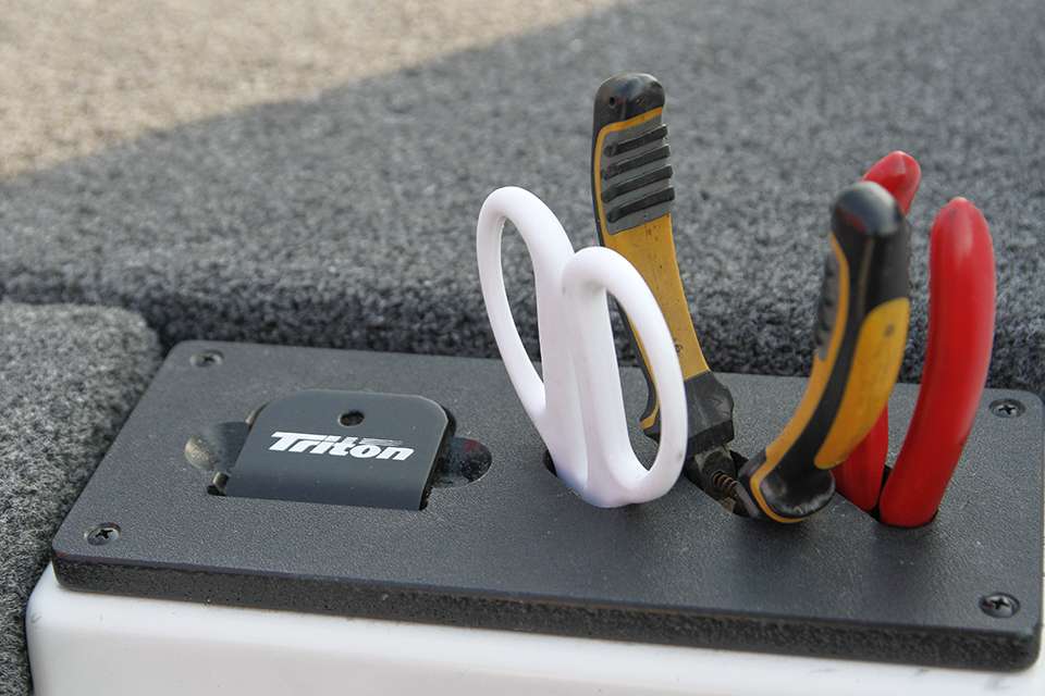 In front of his steering console is a small tool tray that comes standard on his Triton. It has his ruler, scissors, pliers and cutters.