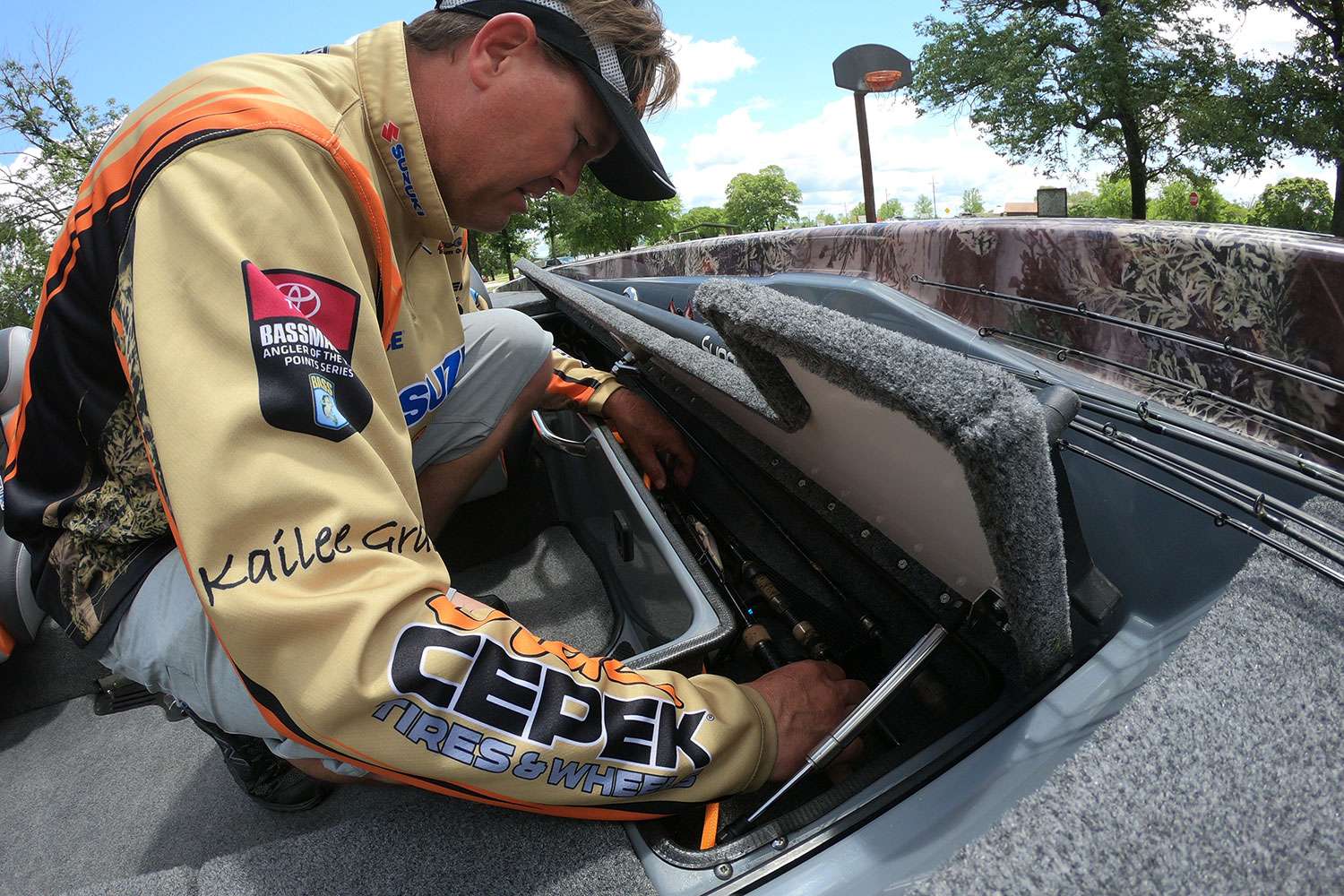 One of the coolest storage areas inside a Phoenix is this additional rod locker. It holds any sort of rod, but spinning rigs work well here. Pirch also keeps another important tool handy here ... 