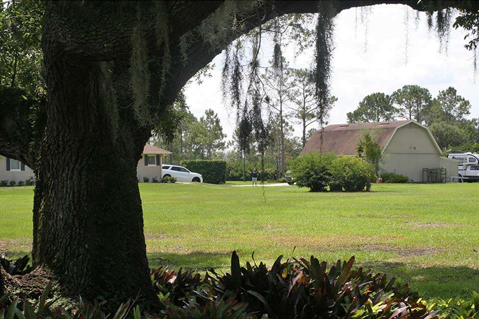 Thereâs Jesse standing in his driveway between his house and garage waiting on his visitor.