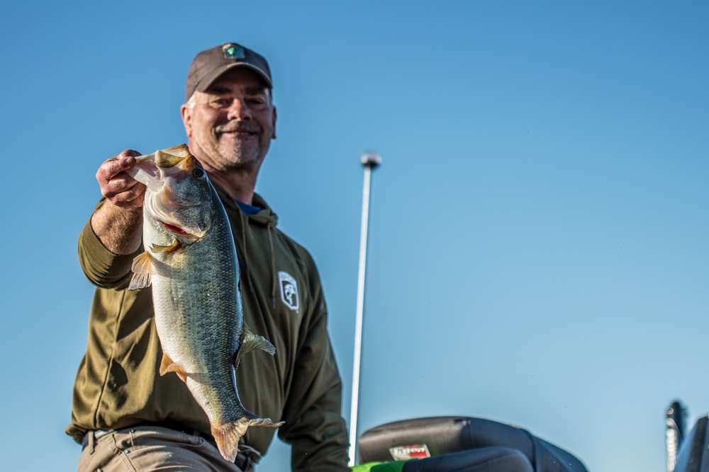 Timothy Penhollow shows a beautiful bass to the cameras.