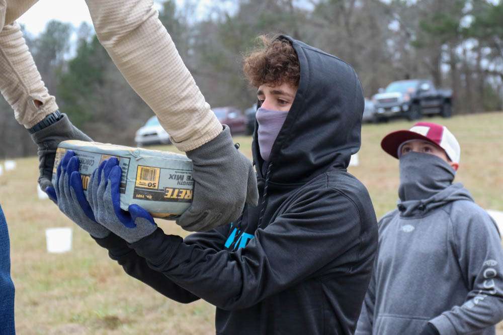 Bags of quick concrete were spread out amongst the buckets. 