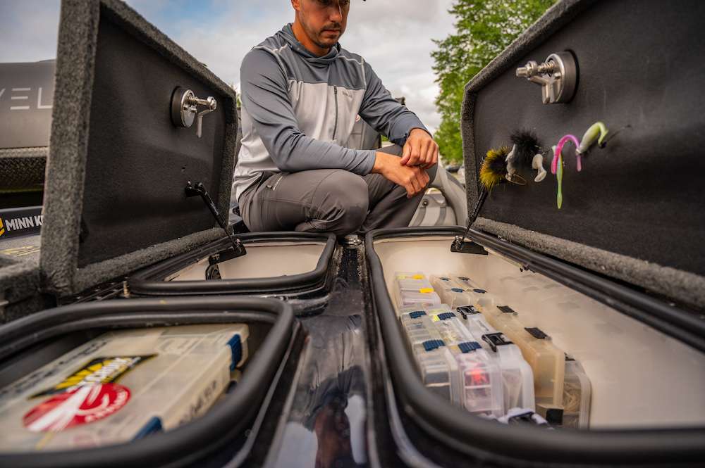 The middle storage section on a Bass Cat is slightly different than other boats. On the left side, one larger box and on the right, two smaller boxes. All three are open at once now and very neatly organized.