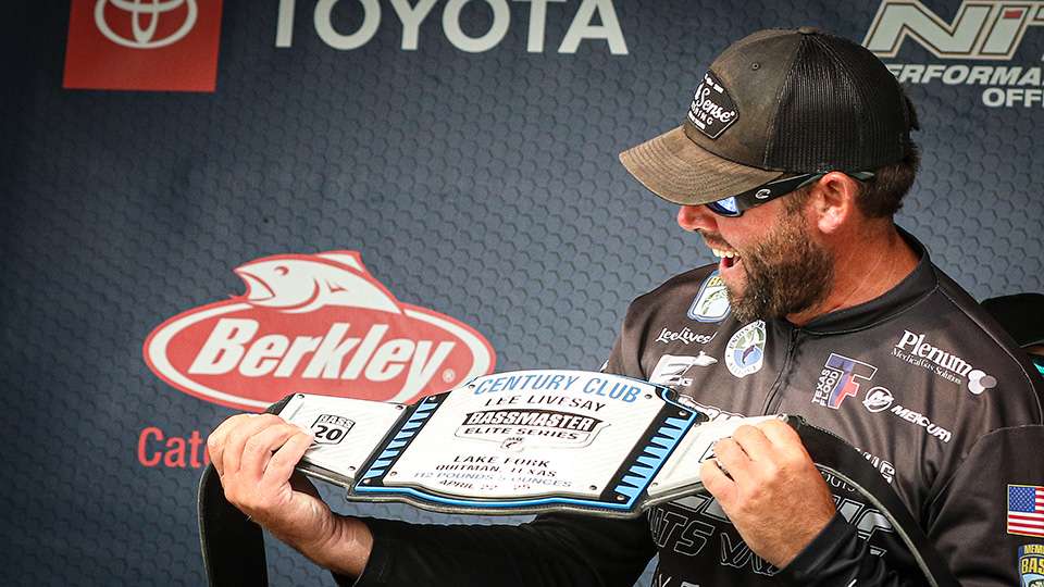 livesay holds his Century Club belt